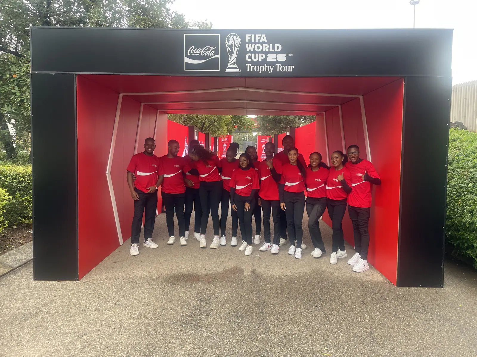 Event crew in the red Coca-Cola tunnel entrance