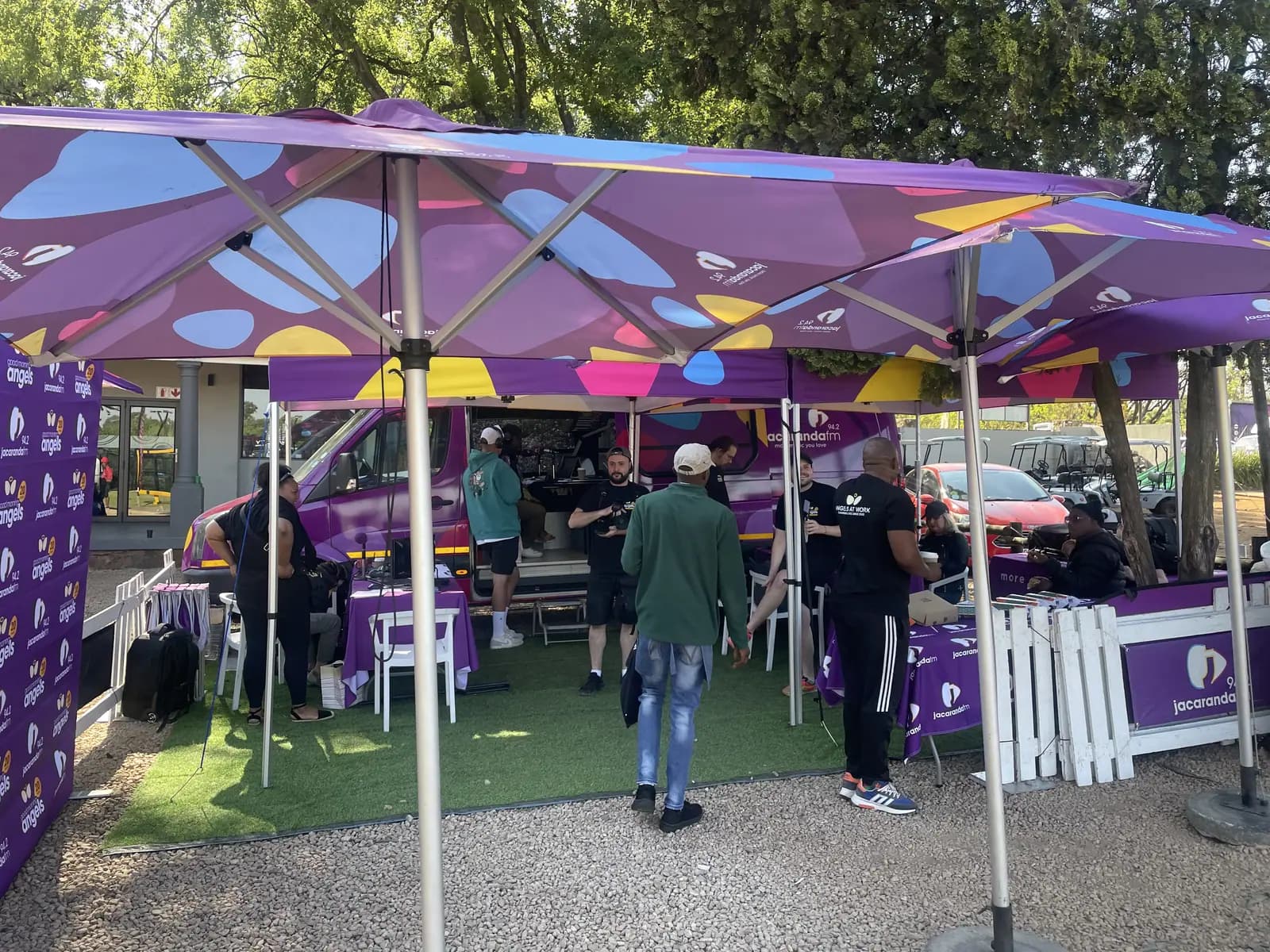 Purple Good Morning Angels hospitality umbrellas and stands